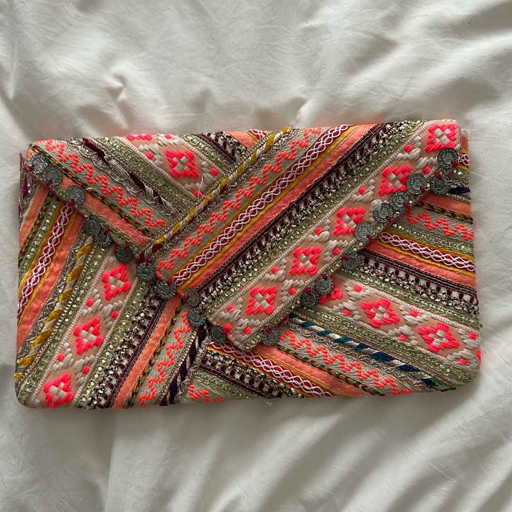 Embroidered pink clutch